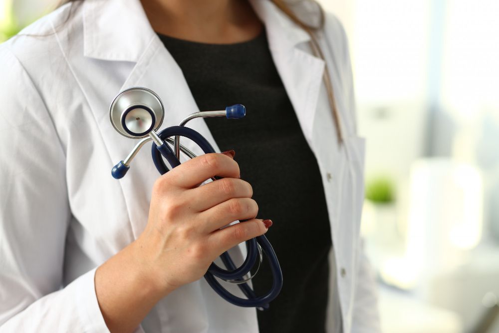 Female doctor hand hold phonendoscope in medical.
